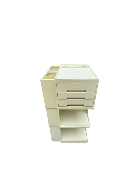 A cream-colored plastic organizer cabinet with three drawers, a top tray, and an open lower shelf, shown on a plain white background.