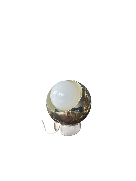 Metallic eyeball lamp with gold on a white background
