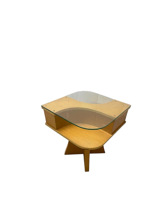 A mid-century modern wooden side table with a clear glass top and a star-shaped wooden base, shown on a plain white background.