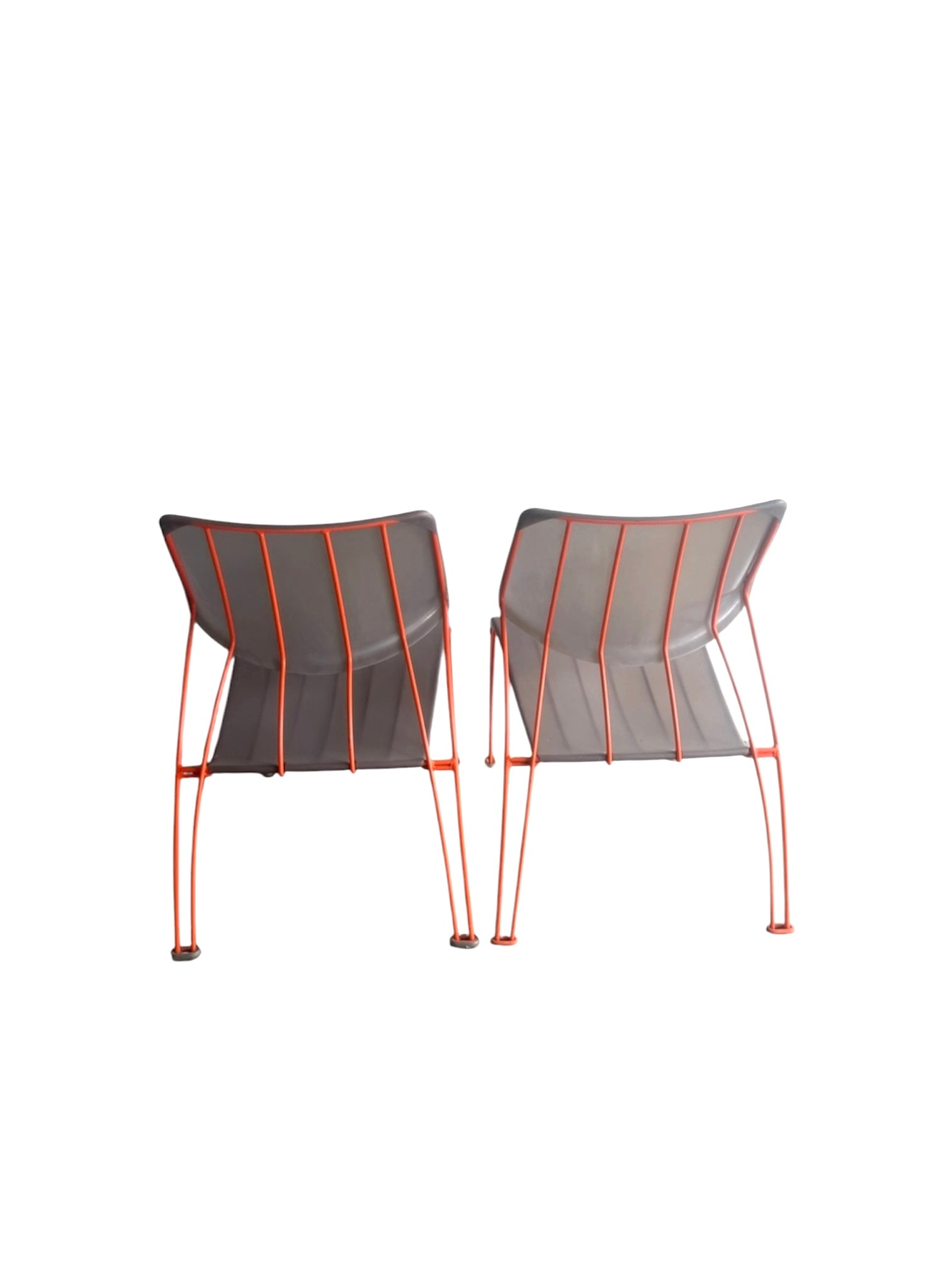 Pair of vintage IKEA Hasslö chairs, back view showing the orange steel frames